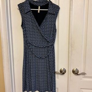 Navy blue and white patterned midi dress with a wrap-around design
